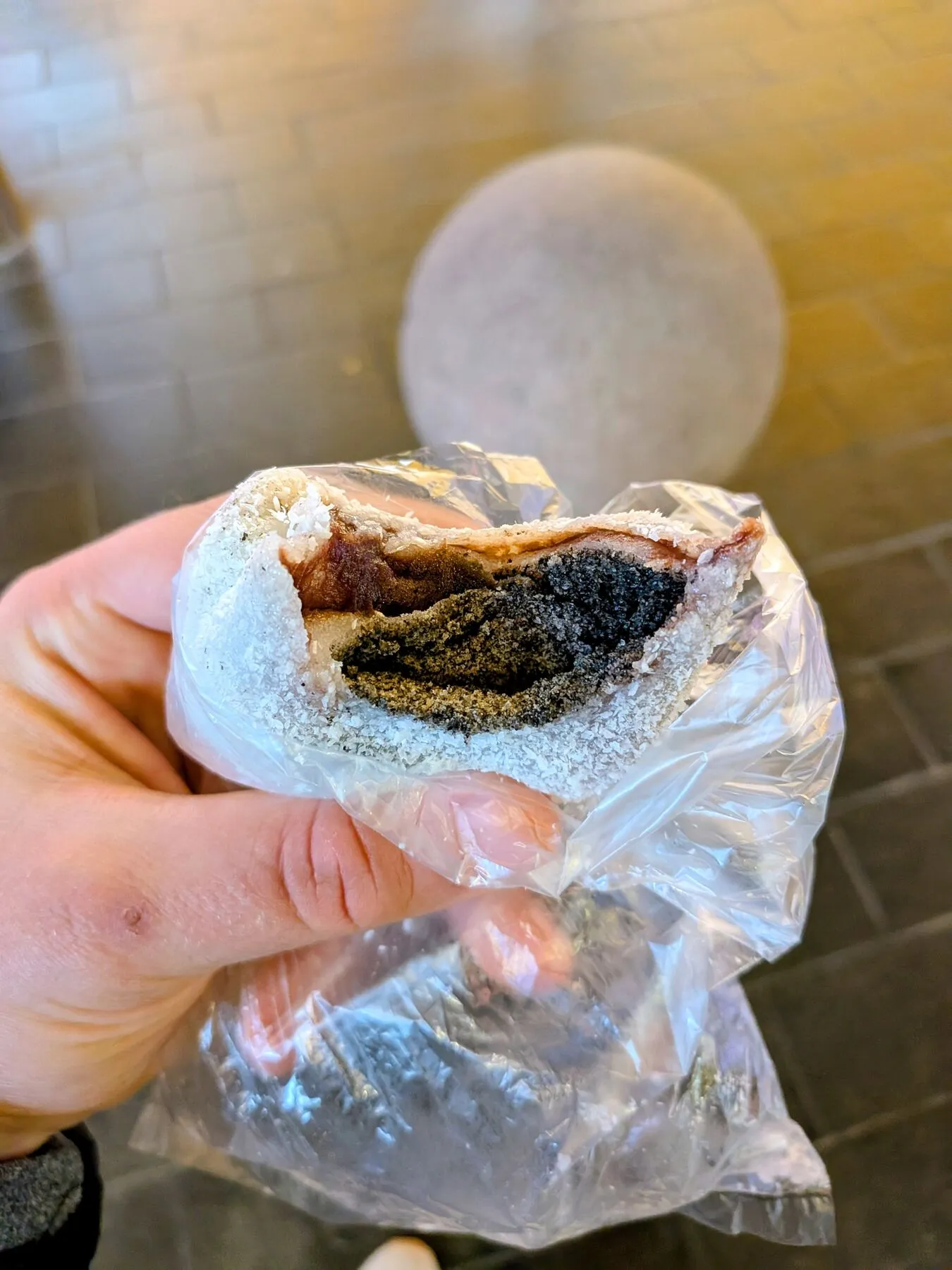 Coated in coconut and filled with that tahini-like black sesame paste