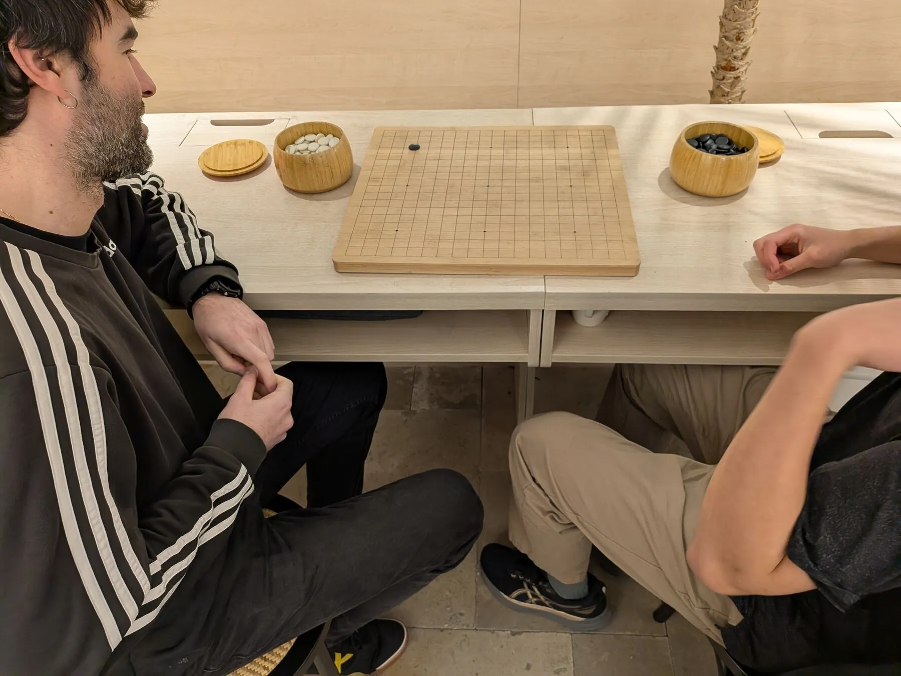 Late-night Go game at the hostel.